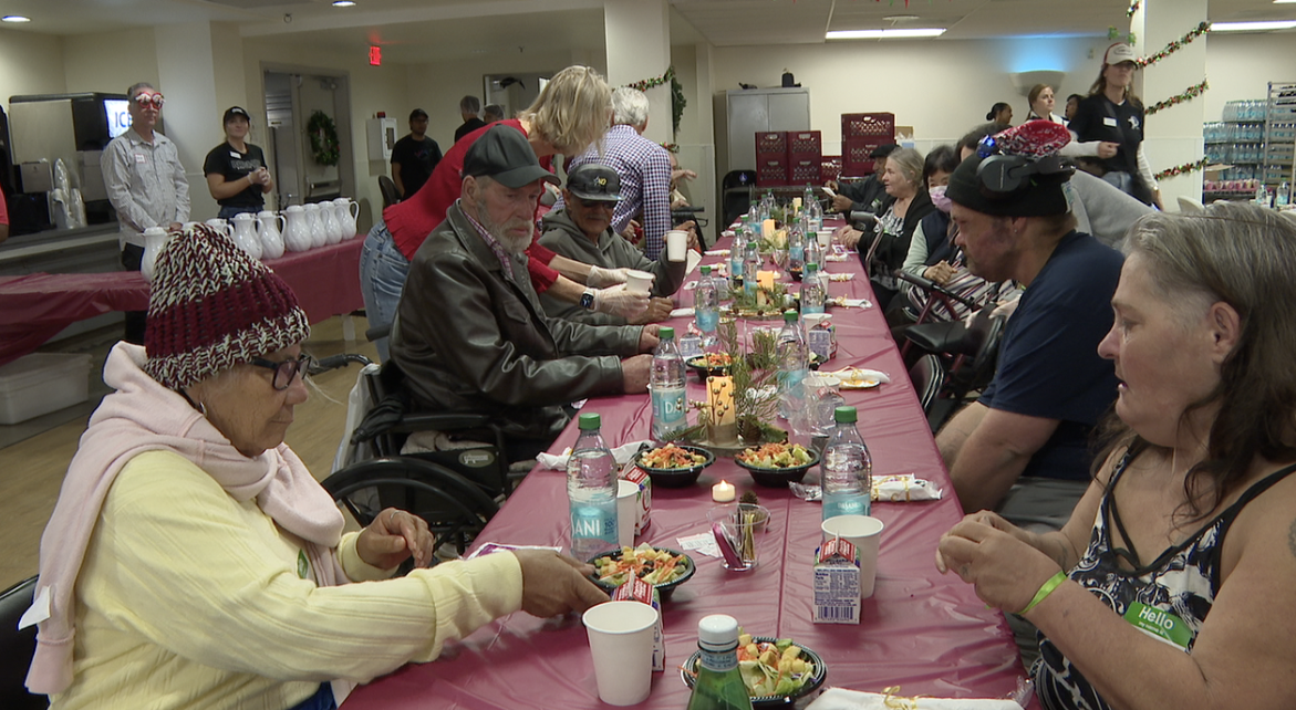 People enjoying a warm meal at the San Diego Rescue Mission.