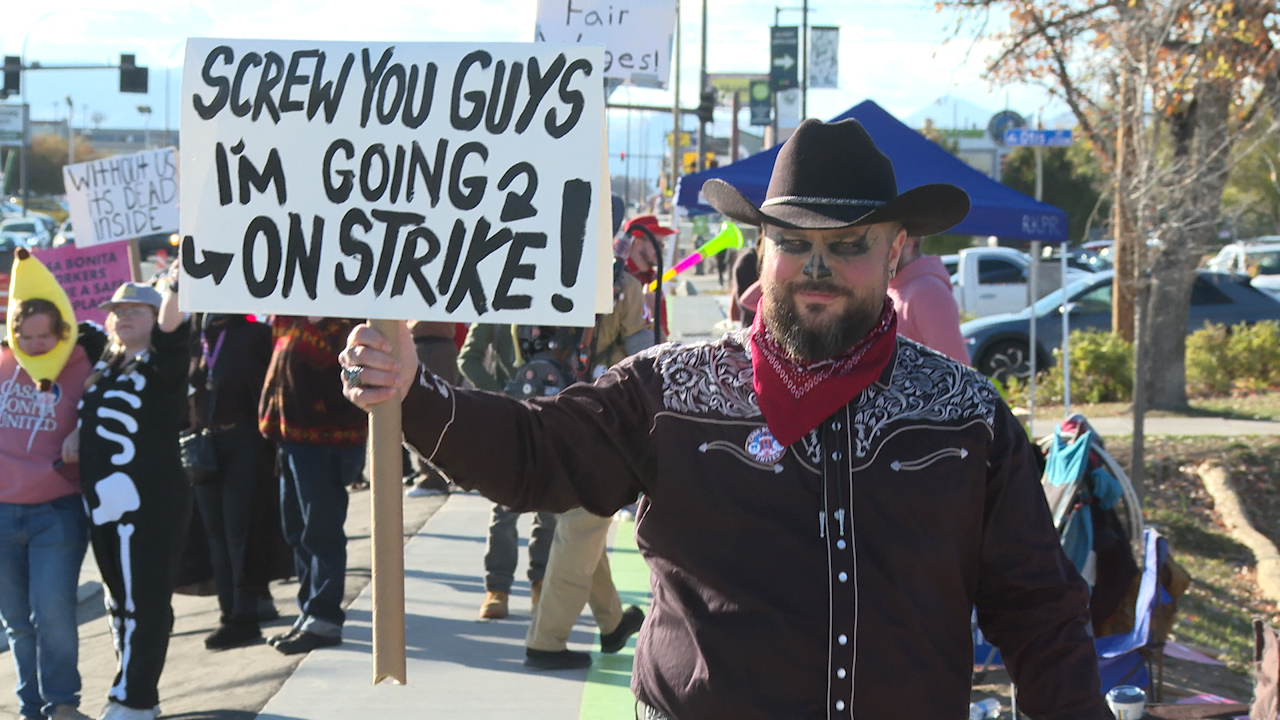 Robert Christie, who plays the character 'Black Bart' at Casa Bonita, strikes with other performers outside the restaurant on Halloween.