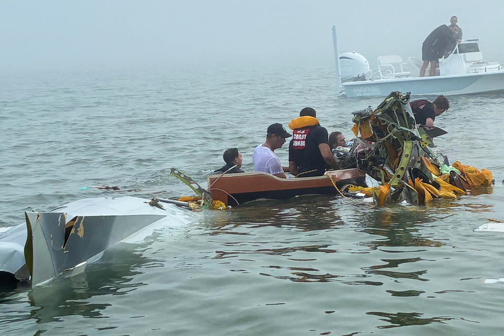 In this image provided by Sky Decker Jr., authorities and volunteers respond to a Mexican Navy plane crash near Galveston, Texas, Monday, Dec. 22, 2025. 