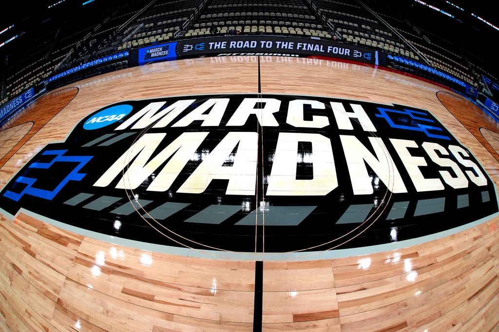 March Madness logo sis displayed at center court during the opening rounds of the NCAA college basketball tournament in Pittsburgh, Wednesday, March 20, 2024. 