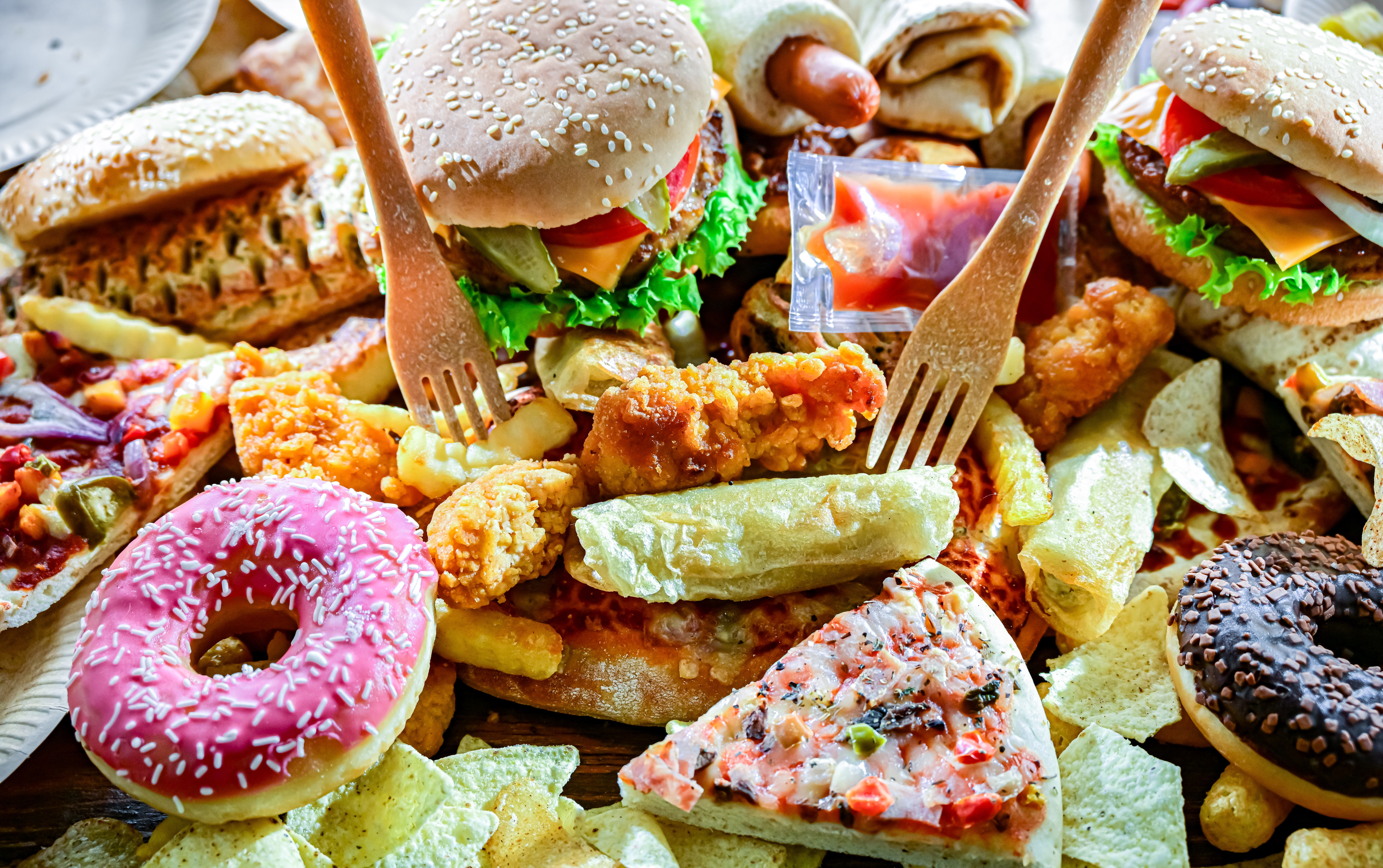 Fast food leftovers in a pile.