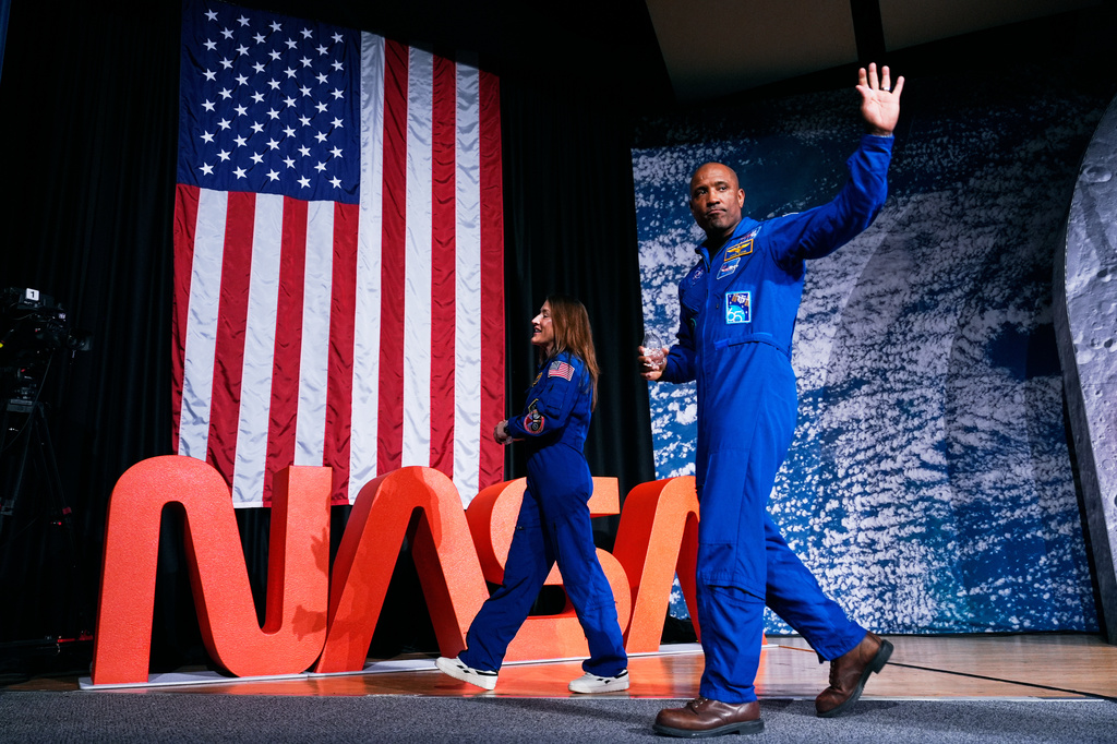 NASA astronauts Victor Glover and Christina Koch, both members of the NASA's Artemis II crew, leave a press conference on Thursday, April 16, 2026, in Houston.