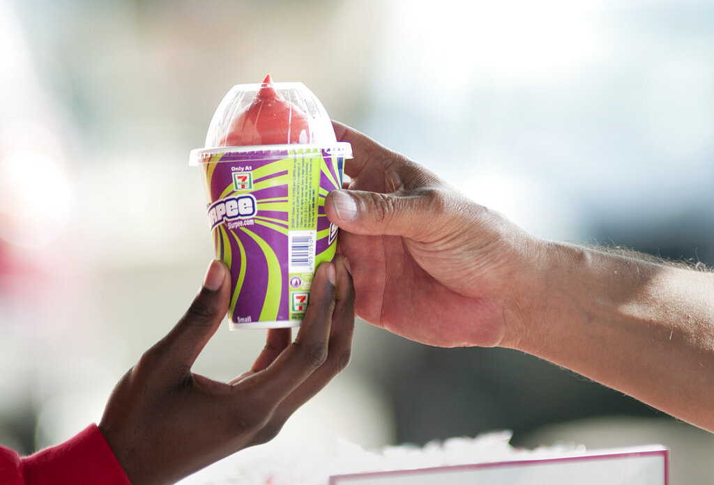 A free Slurpee is handed out to a military service member.