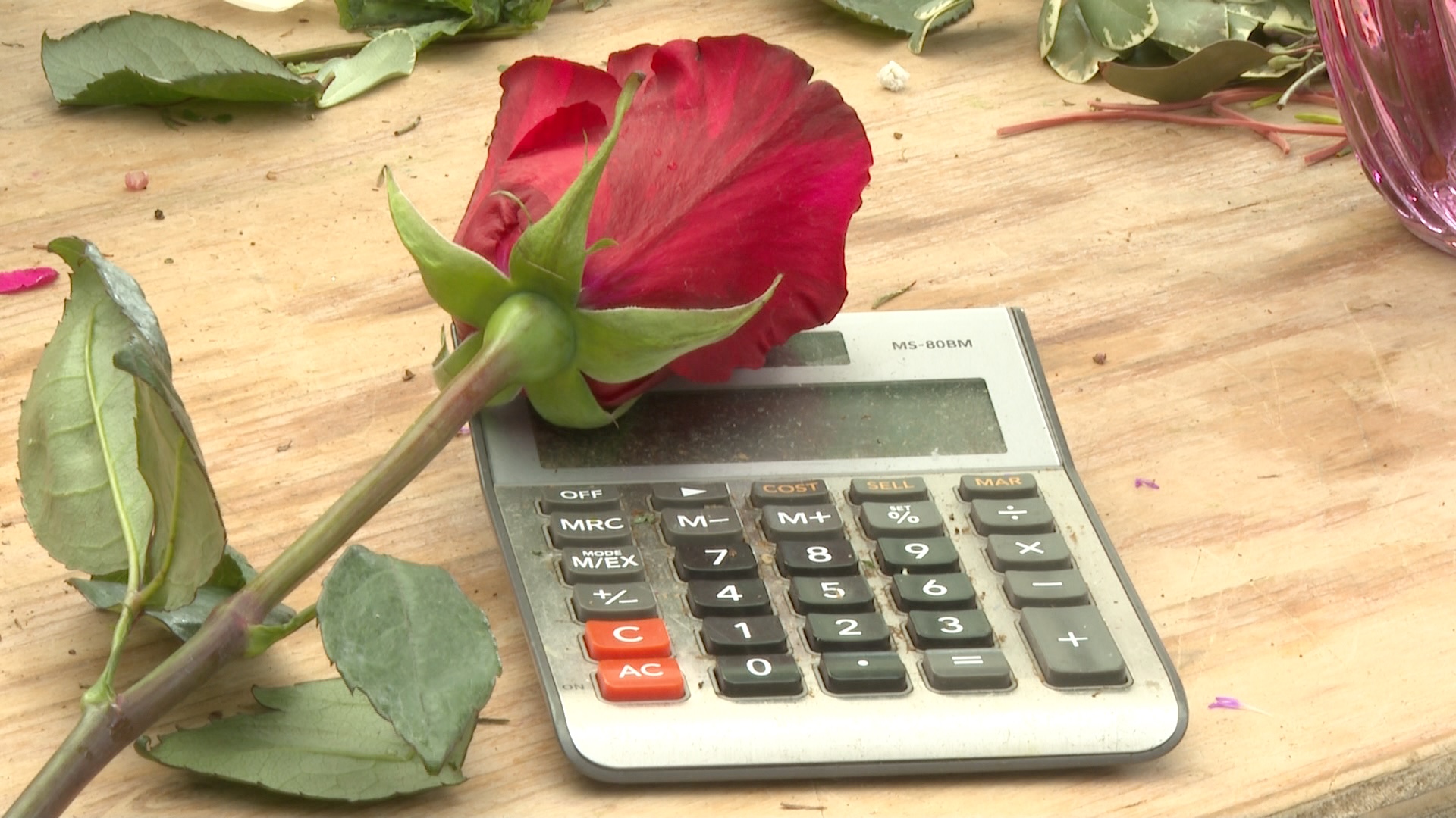 Rose on top of calculator