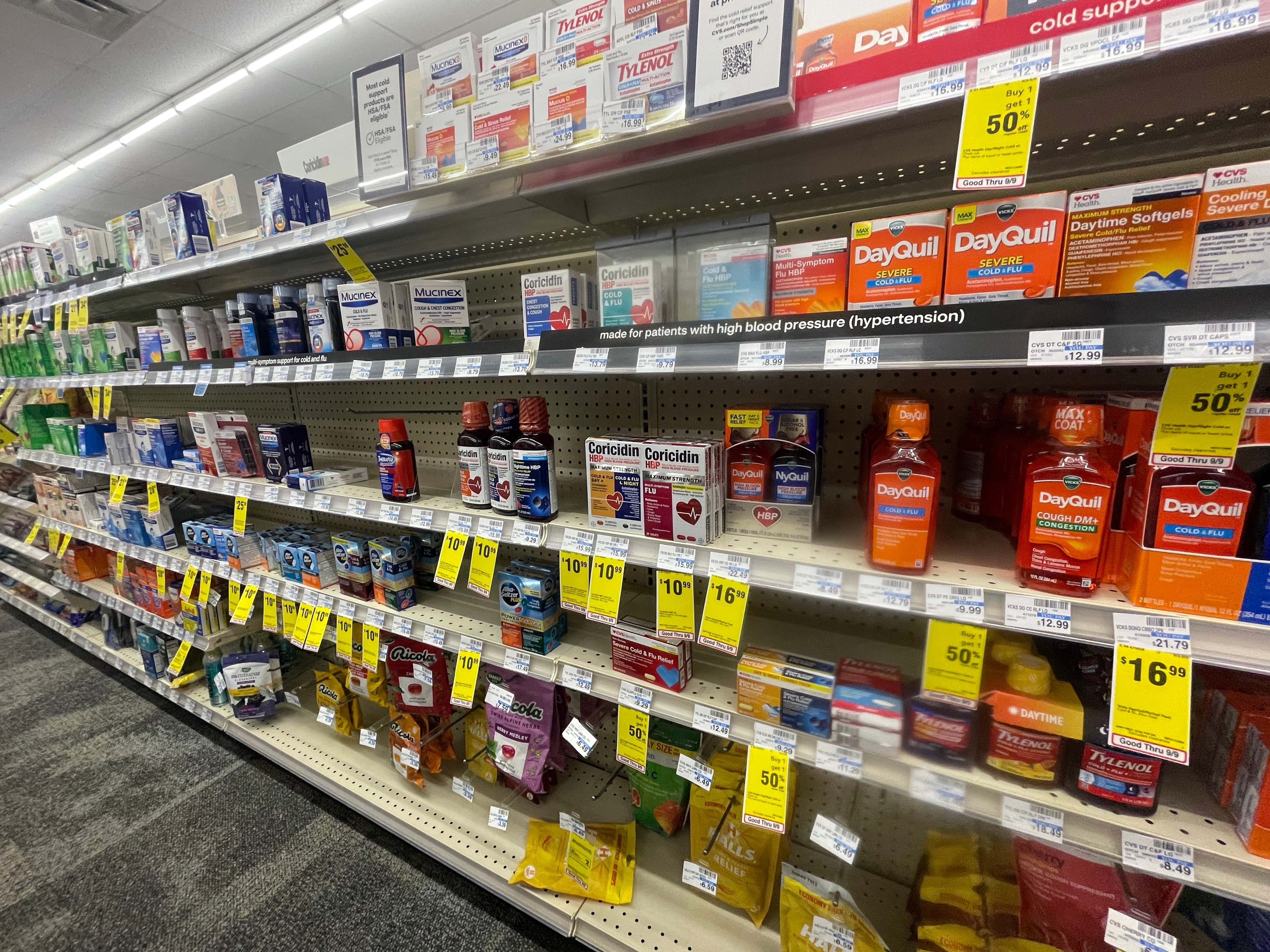 Stock image of various medications on store shelves.