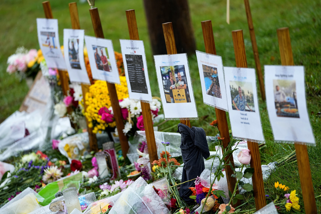 Memorials for those who died in a mass shooting sit along the roadside in Lewiston, Maine.