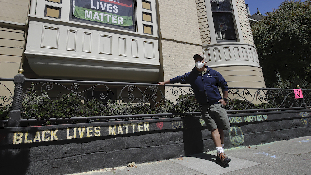 CEO of skincare company apologizes after confronting man for stenciling 'Black Lives Matter' on home