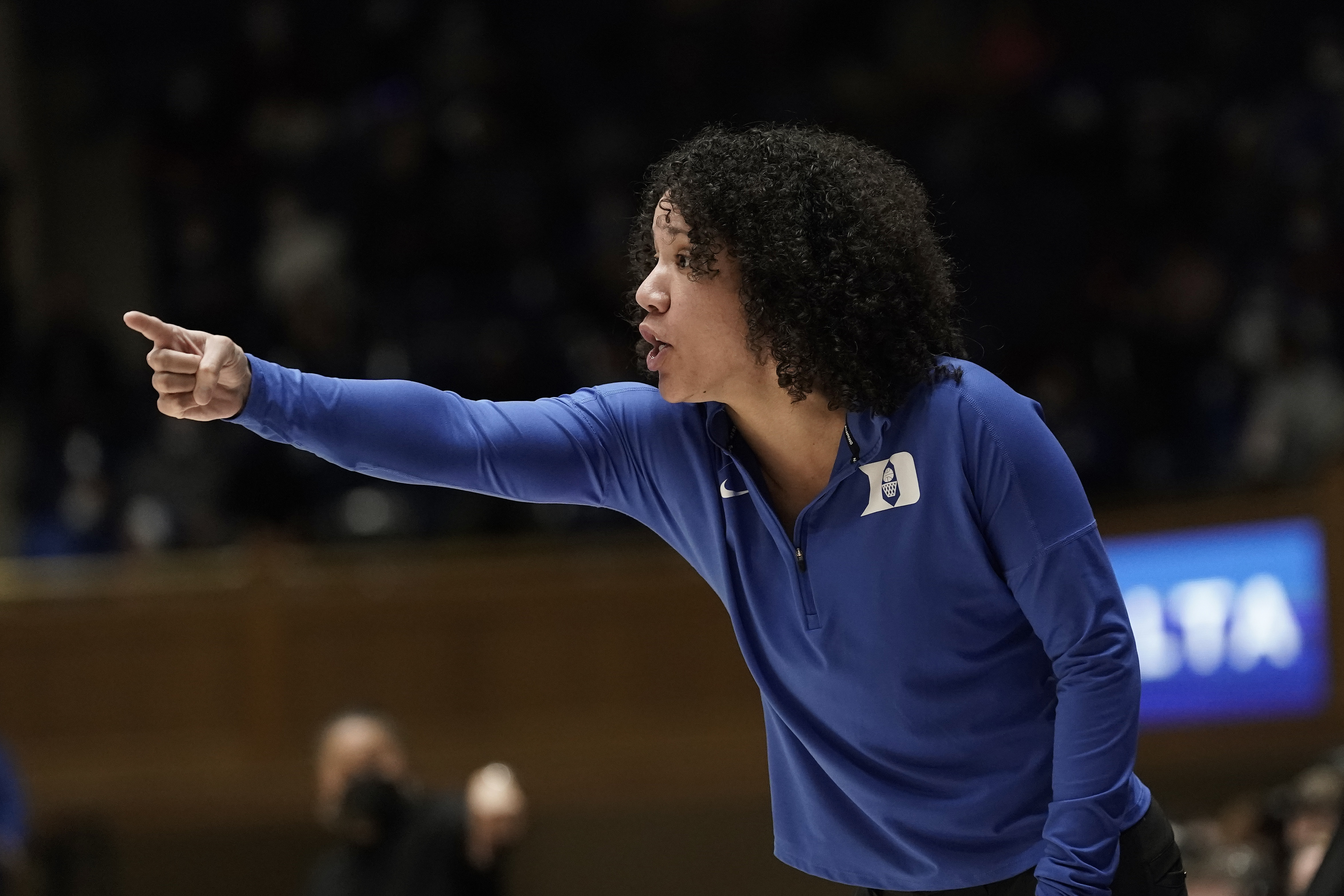 Duke women's basketball coach Kara Lawson points during game in 2021