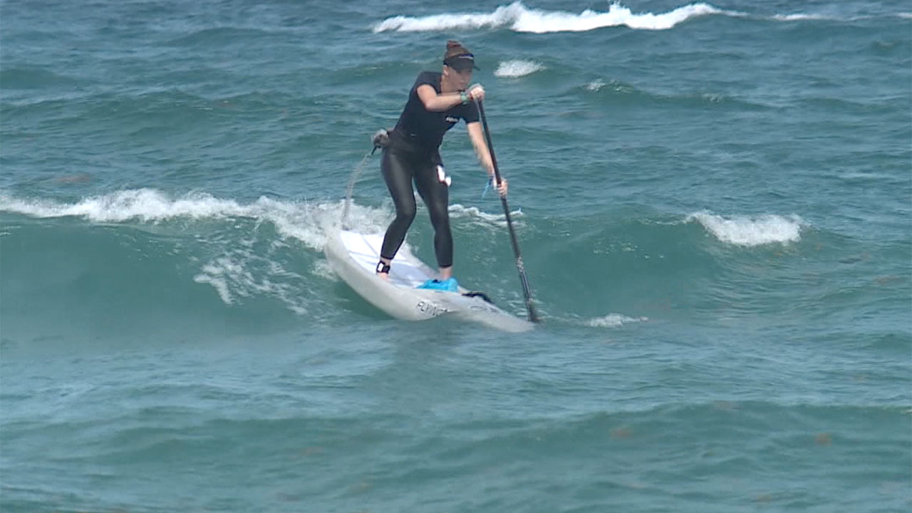 Hundreds of paddleboarders on June 22, 2025, finished an 82-mile journey from Bimini to Lake Worth Beach for a good cause.