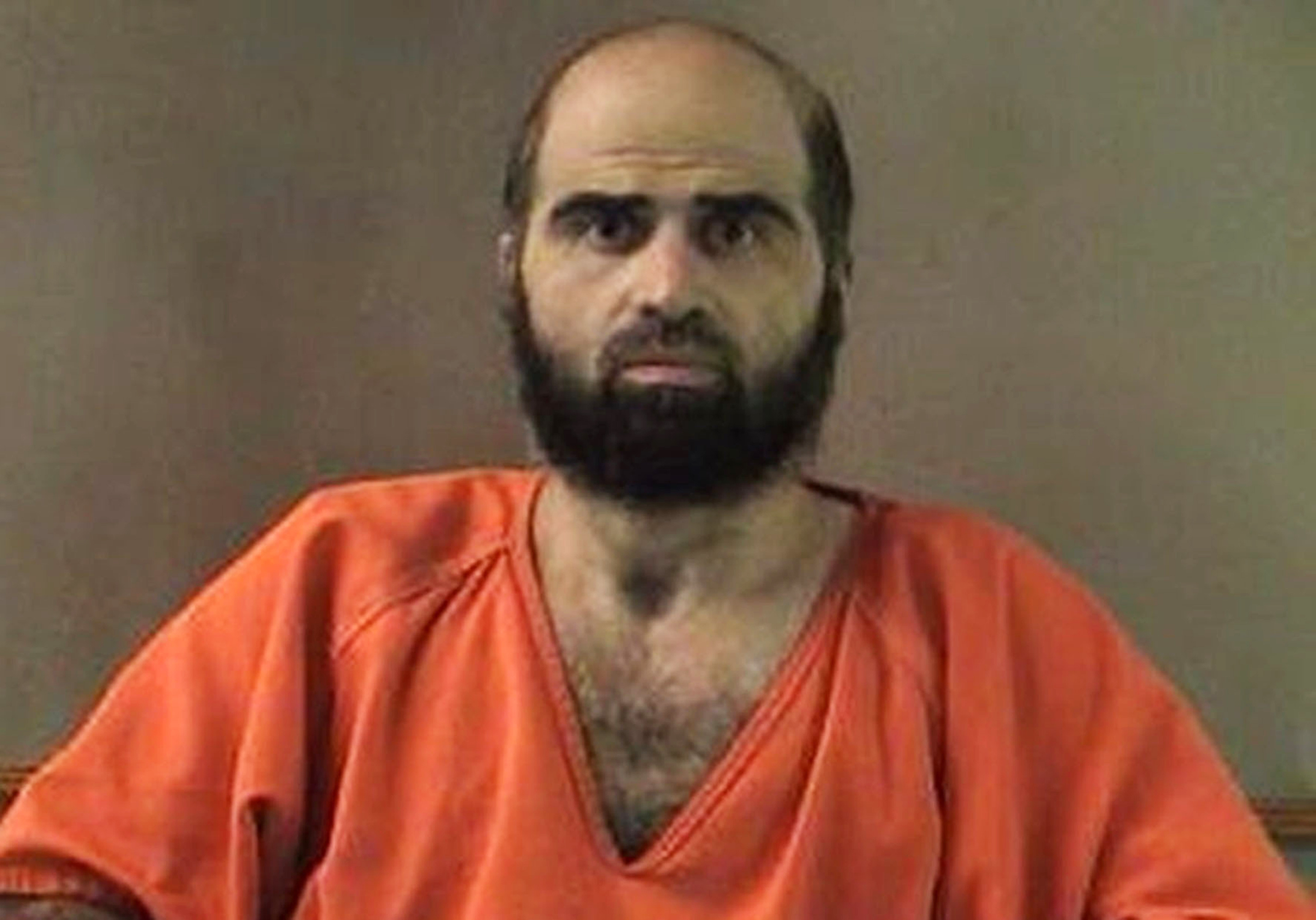 FILE - This undated photo provided by the Bell County Sheriff's Department shows former Army psychiatrist Maj. Nidal Hasan. 