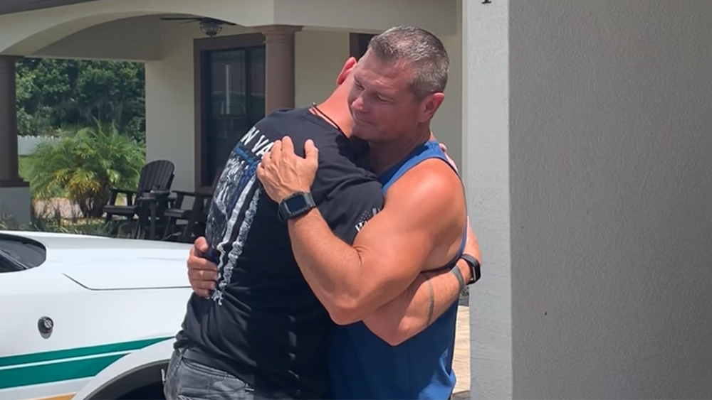 WPTV-BOYNTON-BEACH-OFFICER-HUGGING.jpg