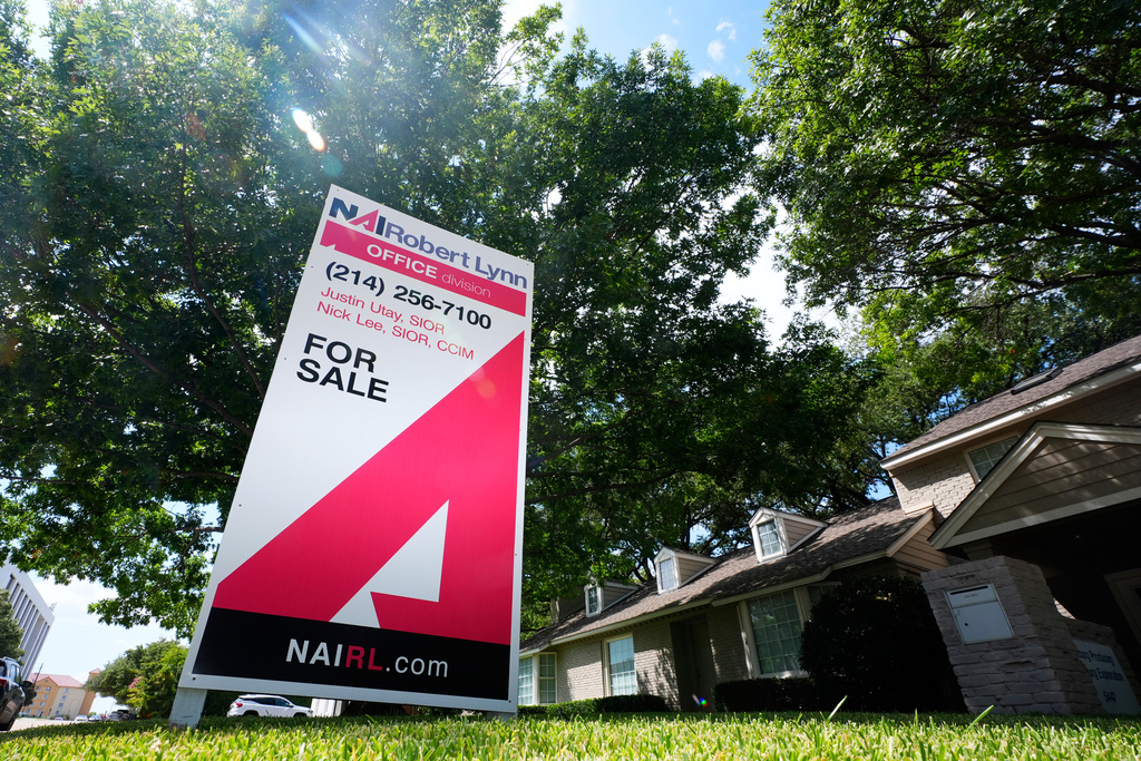 A sign announces real estate for sale in Dallas, Thursday, Aug. 28, 2025. 