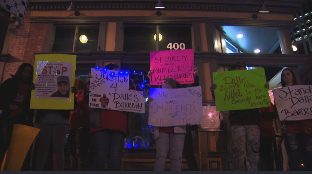 Family and friends of Dallas Barrett gather outside Whiskey Row for peaceful protest