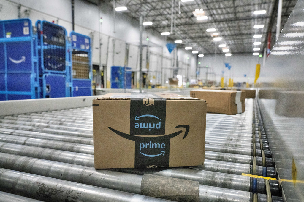 An Amazon package moves along a conveyor belt at an Amazon's DAX7 delivery station.
