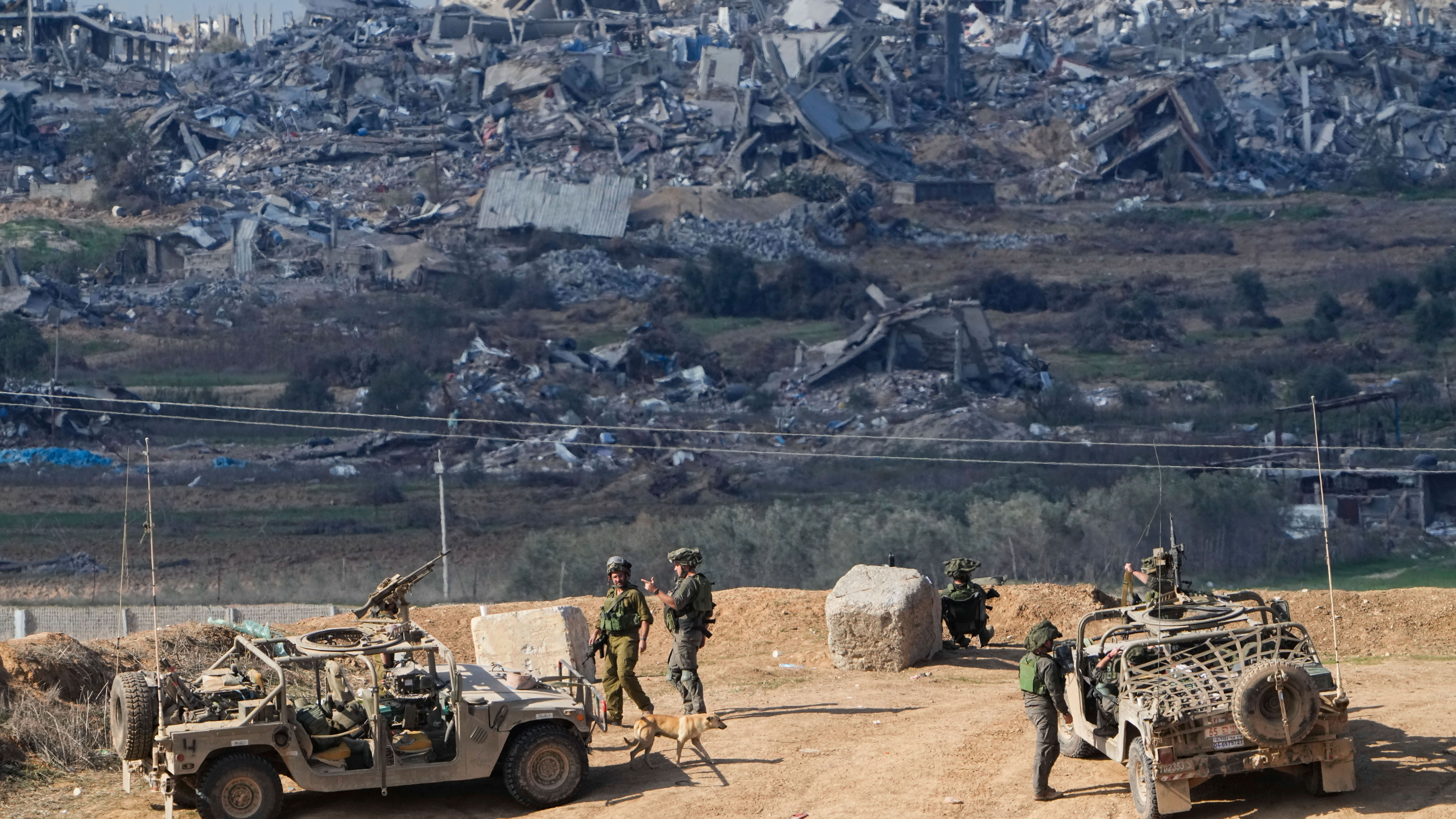 FILE - Israeli soldiers take up positions near the Gaza Strip border, in southern Israel, Friday, Dec. 29, 2023. The army is battling Palestinian militants across Gaza in the war ignited by Hamas' Oct. 7 attack into Israel. 