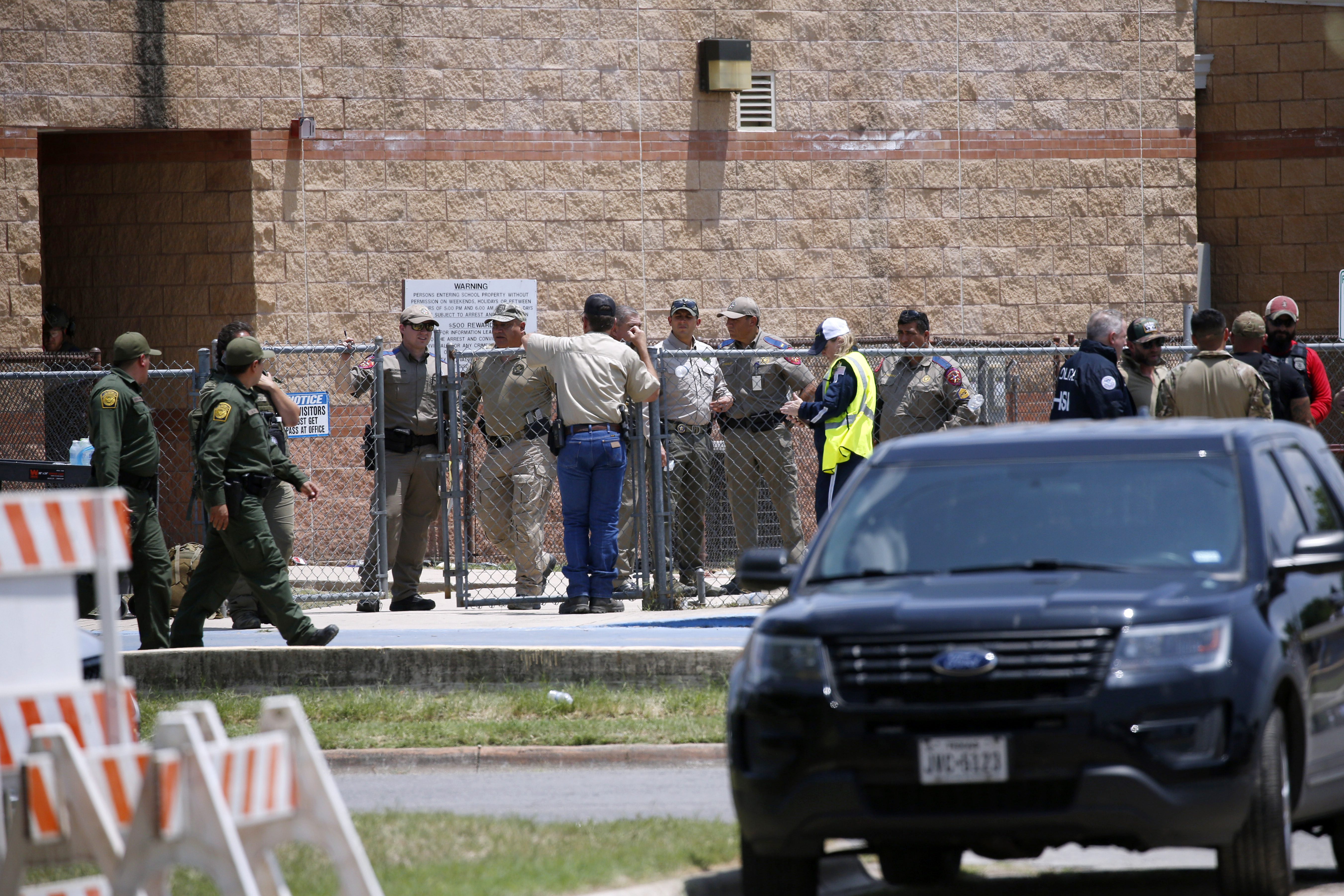 Law enforcement, and other first responders, gather outside Robb Elementary School following a shooting in Uvalde, Texas, on May 24, 2022. 
