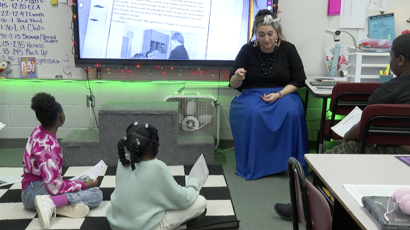 Students working with teachers in "Lit Club" 