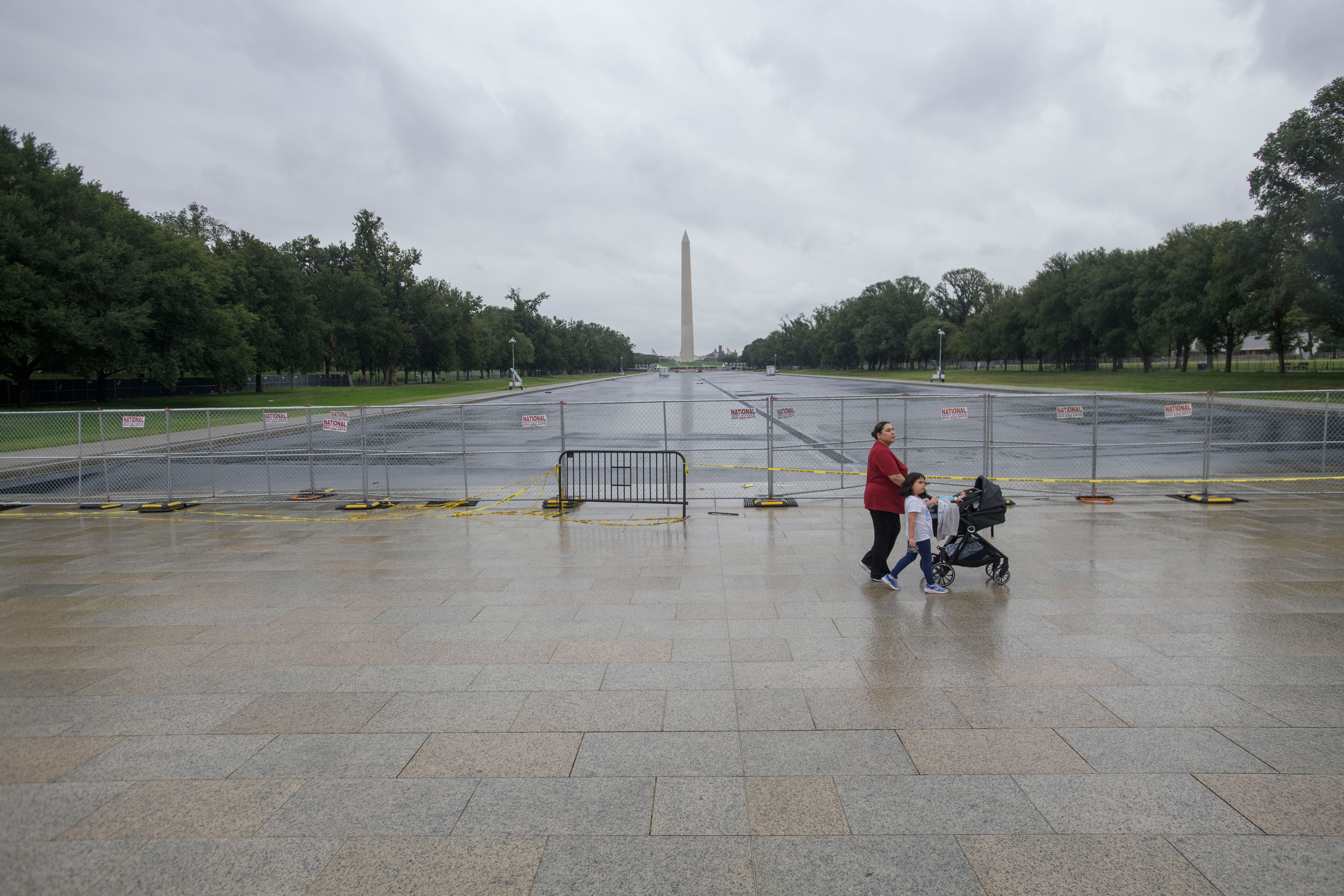 People pass by an empty Reflecting Pool at the Lincoln Memorial in Washington, Monday, Sept. 21, 2026. 