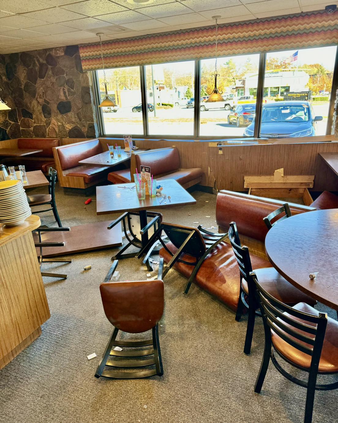Crash damage wide - chairs knocked over booth destroyed
