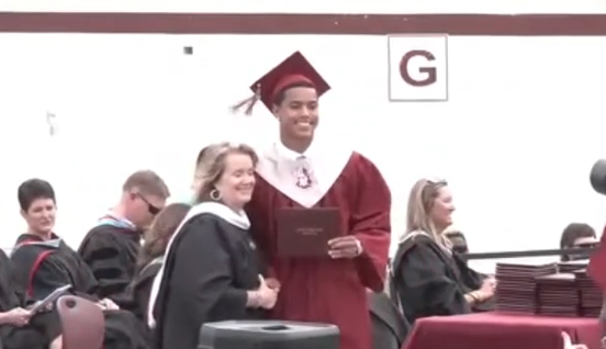Lowndes County student Gavin Yates-Lyons receives his diploma