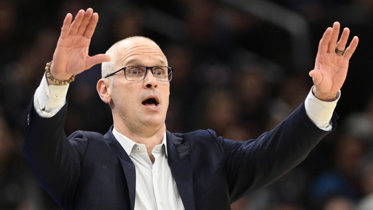 UConn forward Samson Johnson celebrates after a dunk during the Elite 8 college basketball game.
