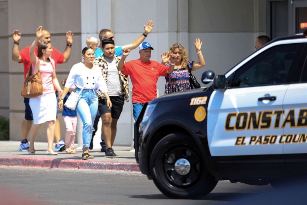 Shoppers exit after a mass shooting at a Walmart in El Paso, Texas, Aug. 3, 2019 (Reuters).