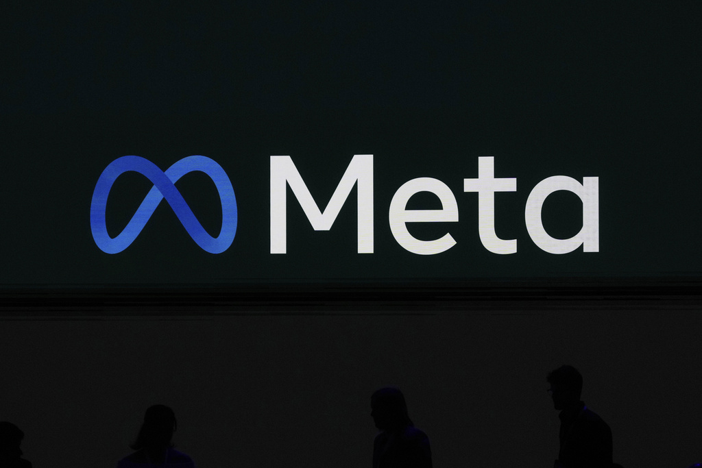 A Meta logo is shown on a video screen at LlamaCon 2025, an AI developer conference, in Menlo Park, Calif., Tuesday, April 29, 2025. 