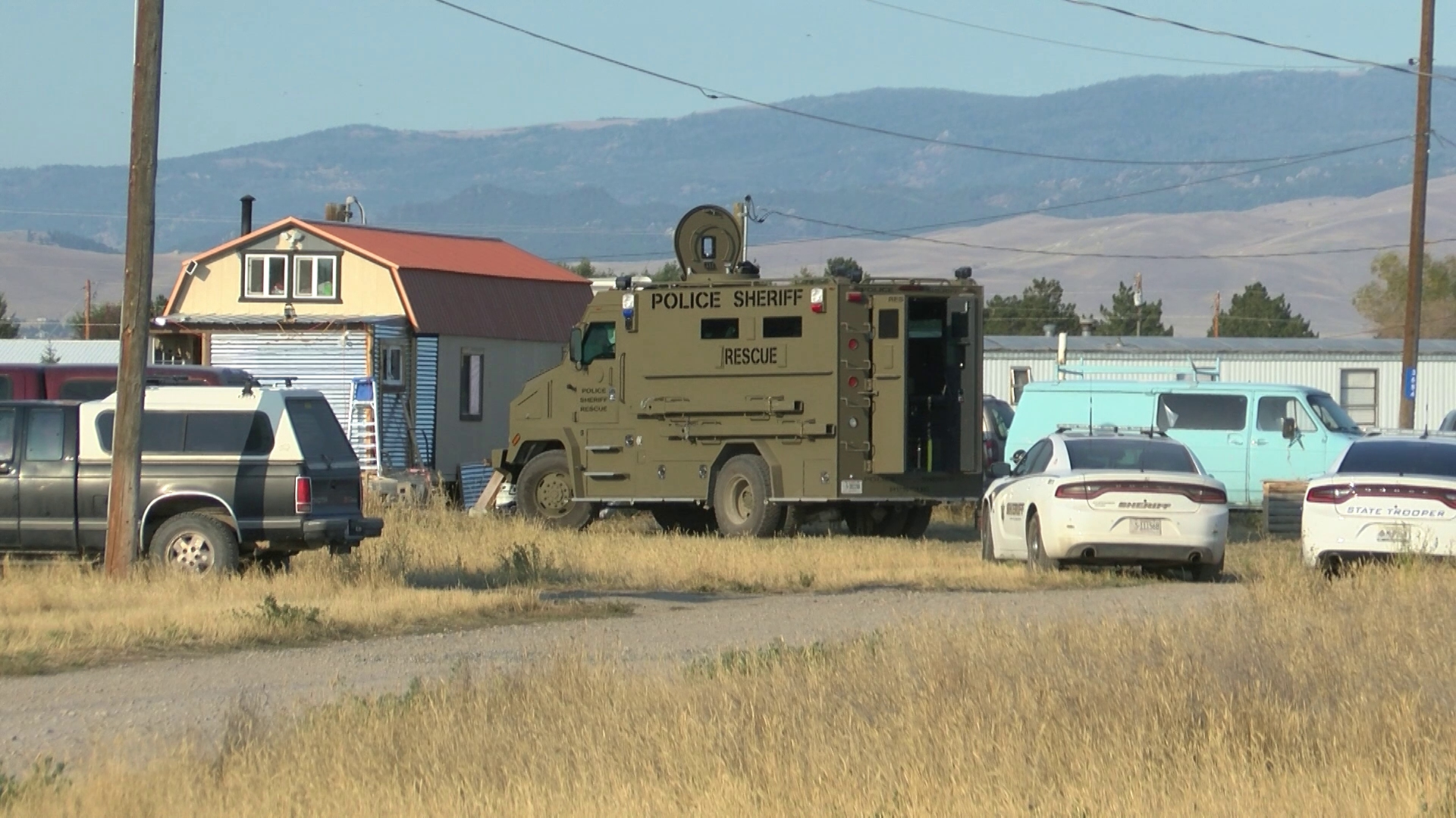 Suspect in custody after hours-long standoff and firing shots "indiscriminately"