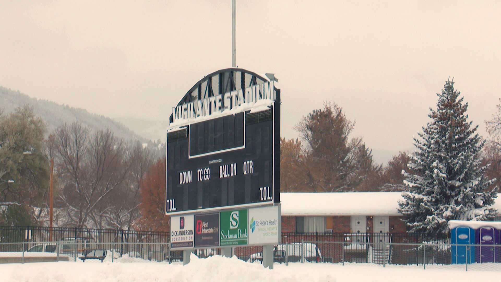 Working to clear snow from Vigilante Stadium