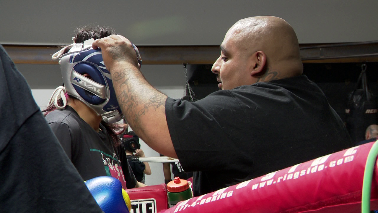 AJ Vasquez with student at Azteca Boxing Club