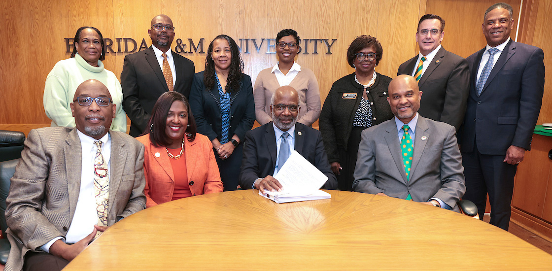 PresidentRobinson&TeamatHBCUloansigning.jpg