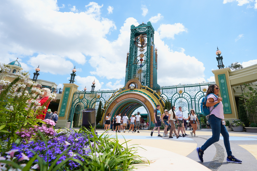 Guests arrive at the main entrance to Epic Universe Theme Park at Universal Resort Orlando, April 10, 2025, in Orlando, Fla. 