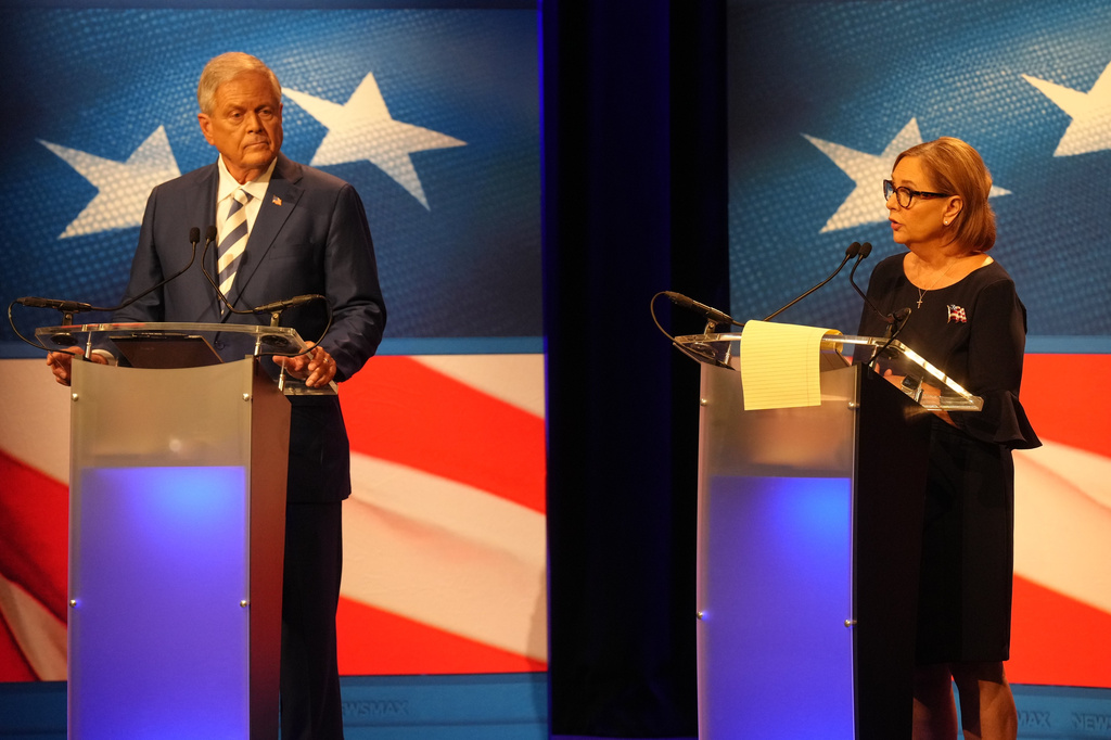 U.S. Rep. Ralph Norman, R-S.C., left, looks on as Sen. Darline Graham, R-S.C., speaks during a debate ahead of the special GOP Senate runoff election to replace the late Sen. Lindsey Graham, R-S.C., in Newberry, S.C., Tuesday, Aug. 18, 2026.