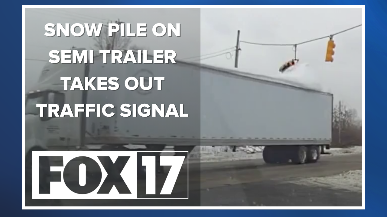 GRAND HAVEN TWP SNOW ON SEMI VS TRAFFIC SIGNAL.png