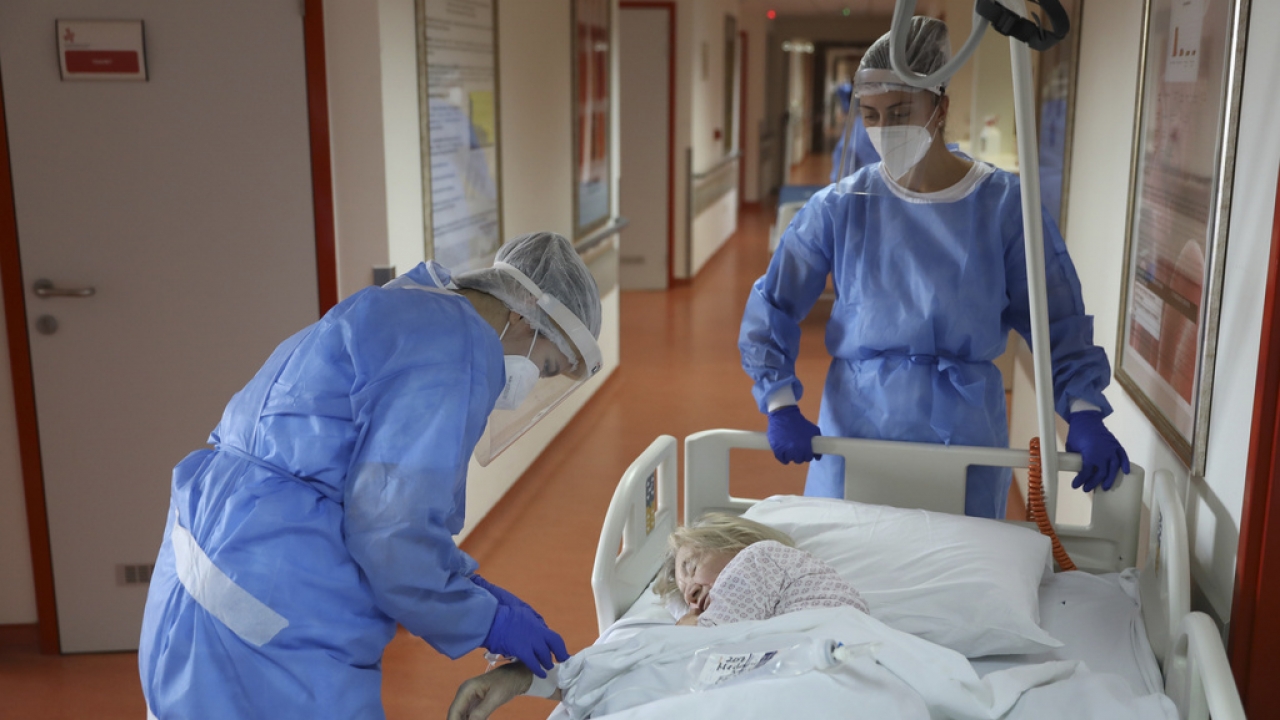 Medical staff attend to a patient.