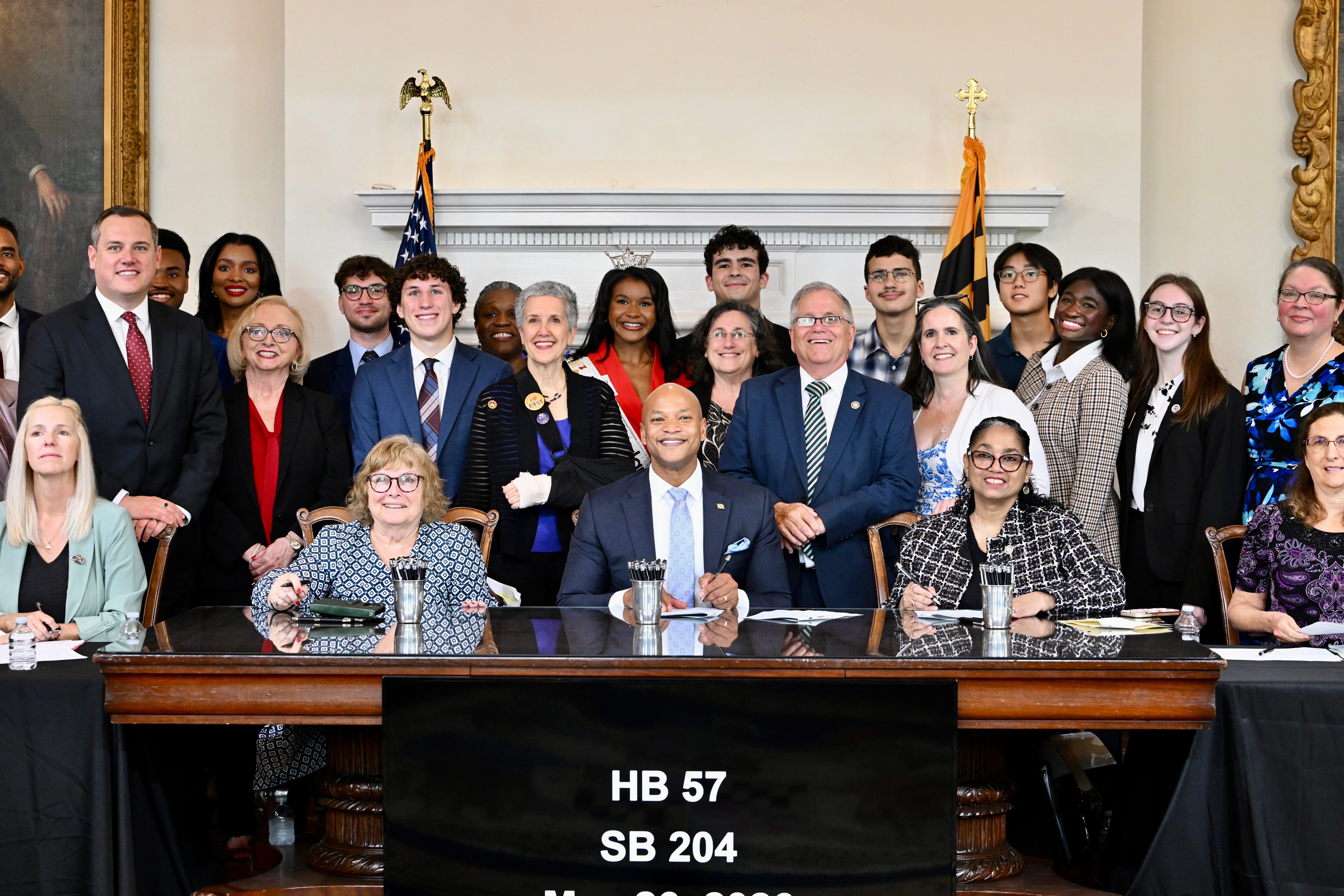 Kinsley, Chris, and elected officials at the bill signing