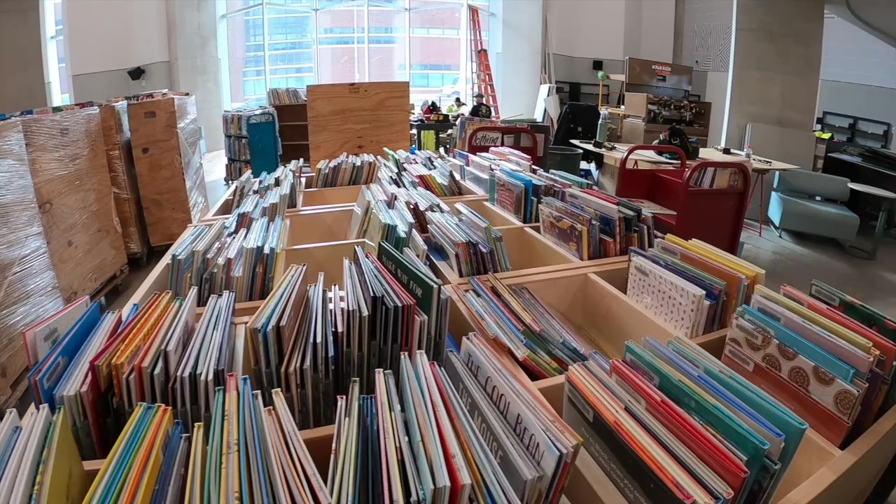 Rolling carts of books sit in the nearly finished children's area at the Cleveland Public Library's new Martin Luther King Jr. branch in University Circle.