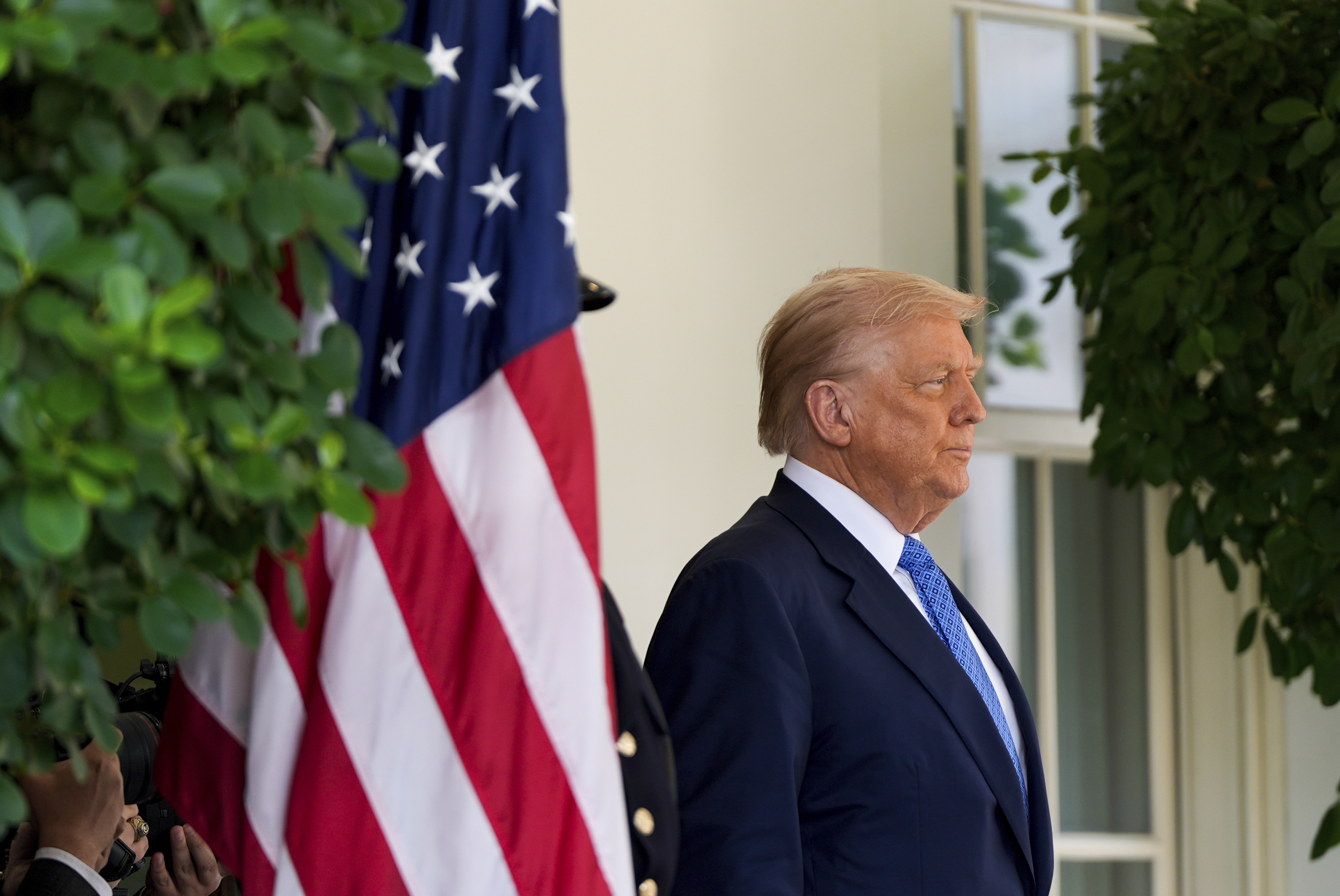 President Donald Trump waits to greet Armenia's Prime Minister Nikol Pashinyan at the White House, Friday, Aug. 8, 2025, in Washington.