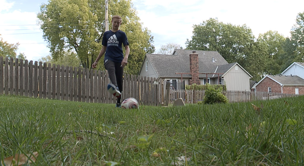 Brady doing one of many things he loves to do, play soccer