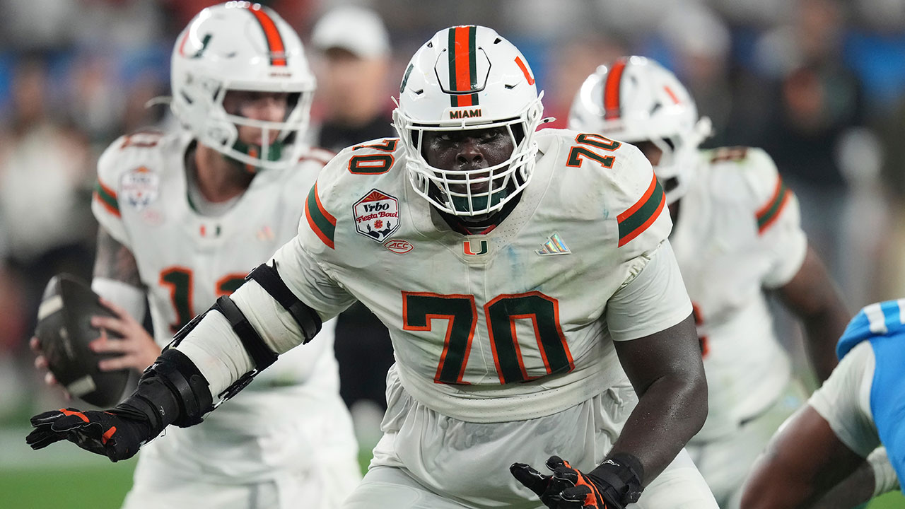 Miami Hurricanes offensive lineman Markel Bell looks to make a block against Mississippi during the second half of the Fiesta Bowl NCAA college football playoff semifinal game, Thursday, Jan. 8, 2026, in Glendale, Ariz. (AP Photo/Ross D. Franklin)