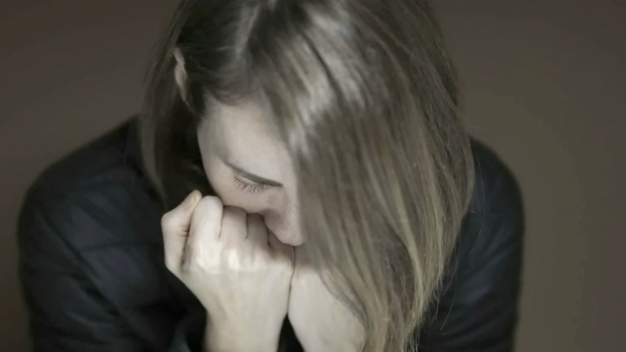 Domestic violence, scared woman 