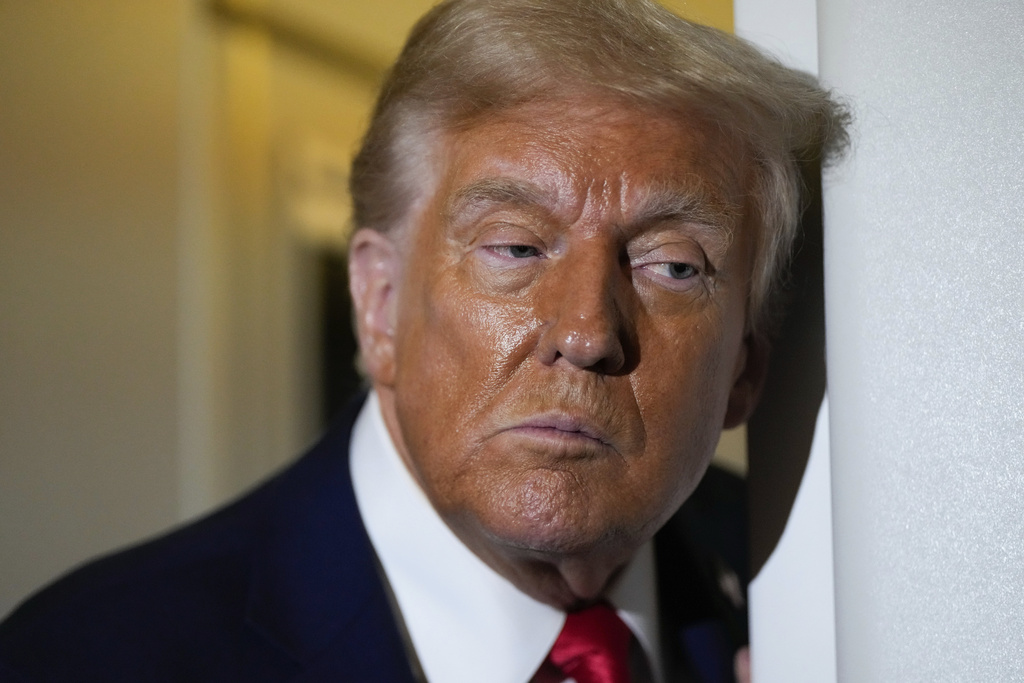 President Donald Trump speaks to reporters aboard Air Force One while en route to Joint Base Andrews, Md. after attending a memorial for conservative activist Charlie Kirk in Glendale, Ariz., Sunday, Sept. 21, 2025. 