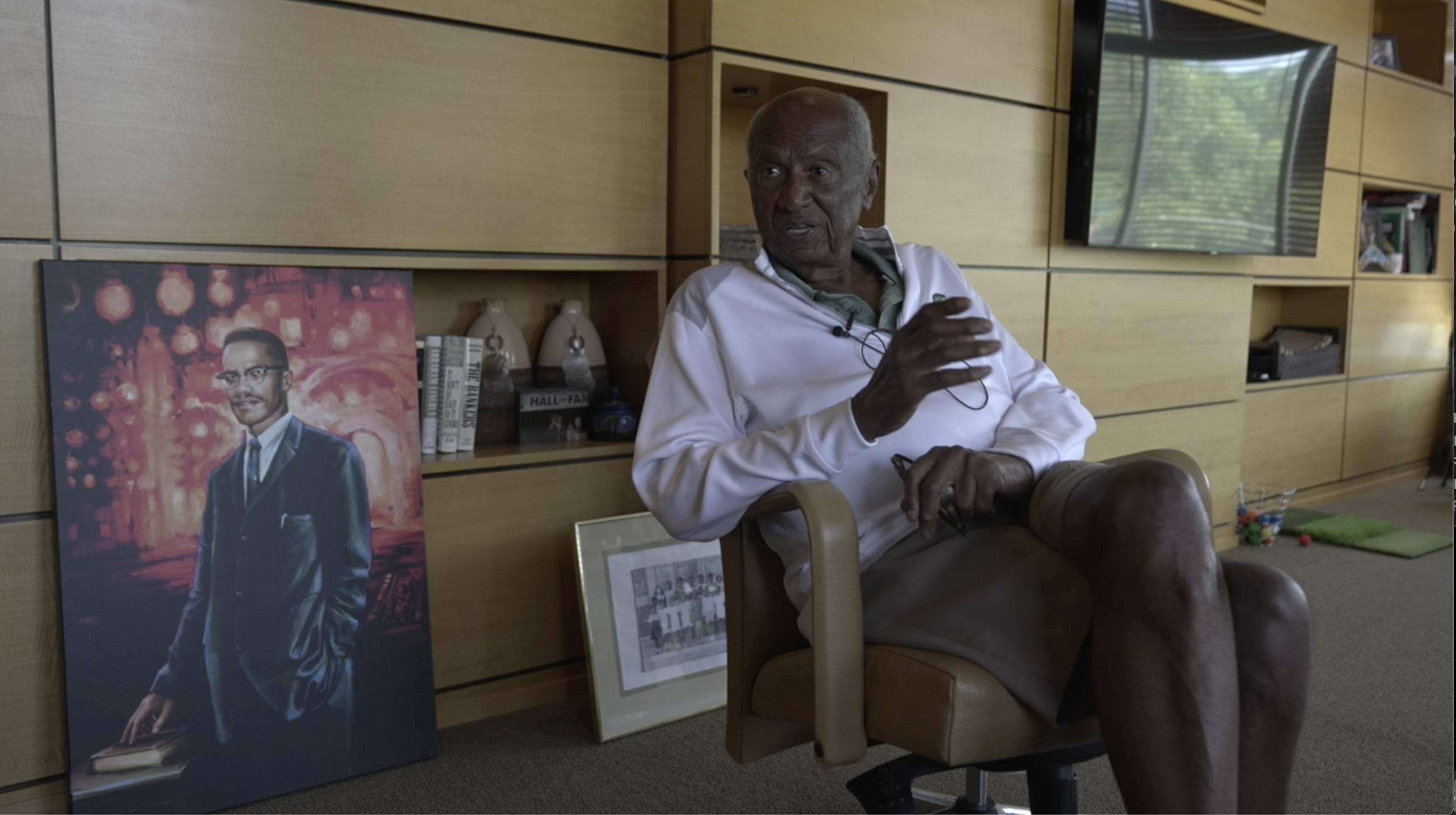 Joel Ferguson, Chairman of Ferguson Developers, with his painting of Malcolm X