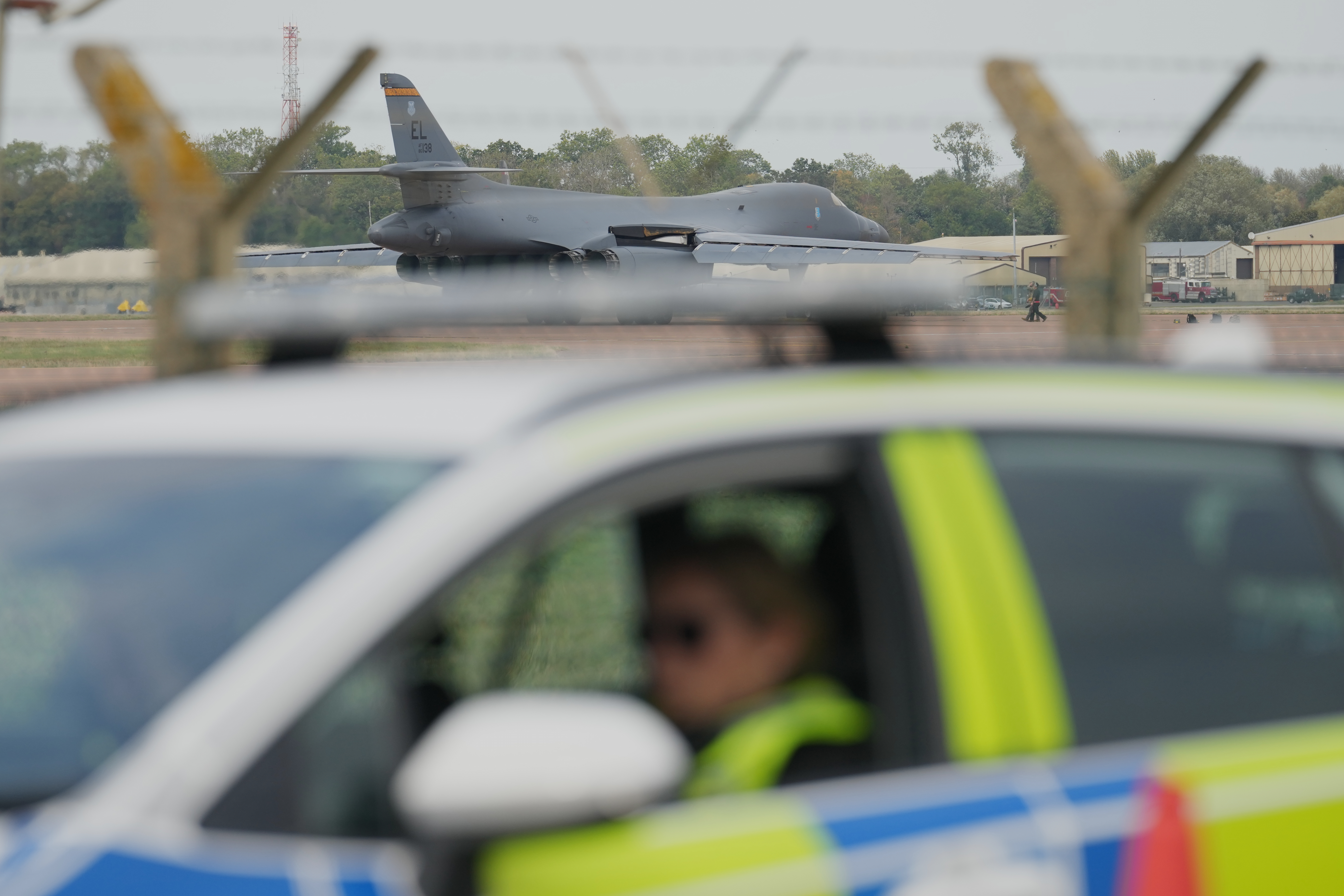FILE - A B1 bomber prepares to take off as police officers guard a checkpoint near RAF Fairford air base, in Fairford, England, Tuesday, Sept. 29, 2026.