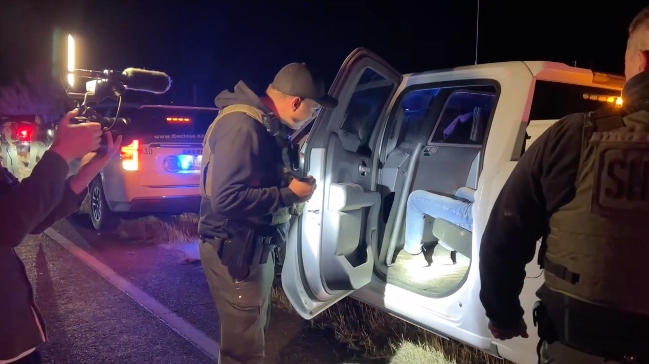 Cochise County Sheriff's Deputy Dan Brennan checks on a teenager