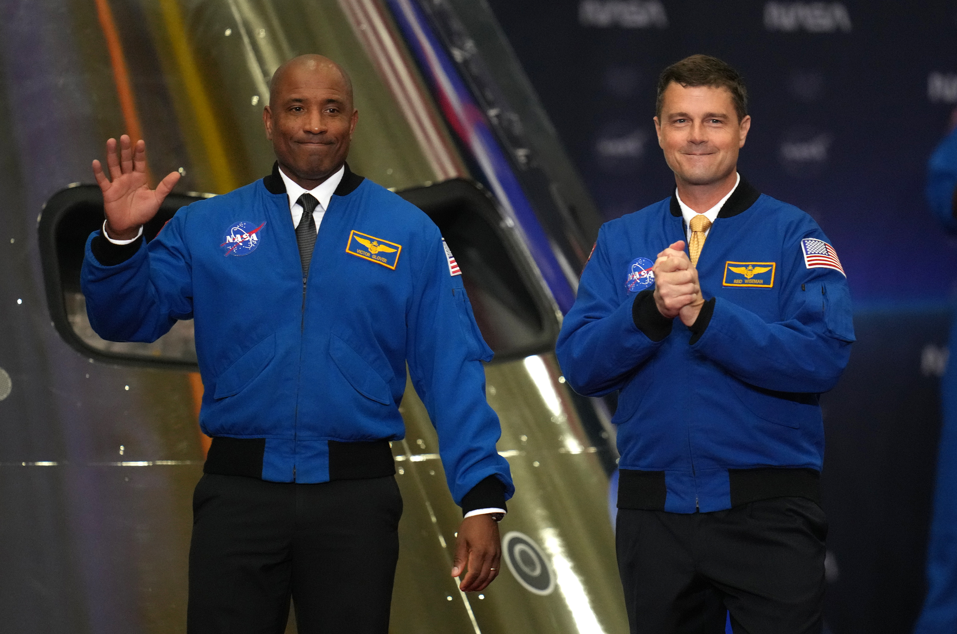 FILE - Artemis II Pilot Victor Glover, left, and Commander Reid Wiseman, right, participate in a Congressional Space Medal of Honor ceremony at NASA's Johnson Space Center, Aug. 28, 2026, in Houston. 