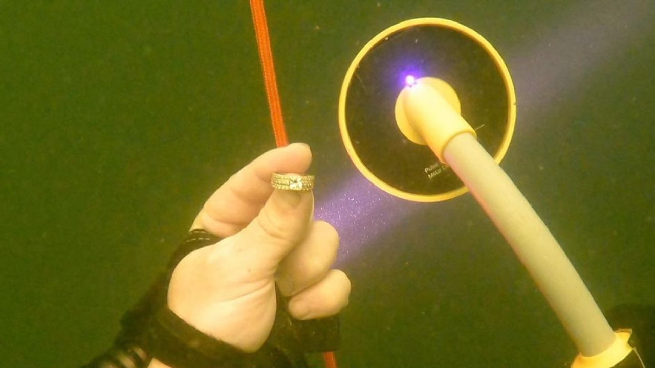 Diver finds woman's wedding ring lost at bottom of a lake.