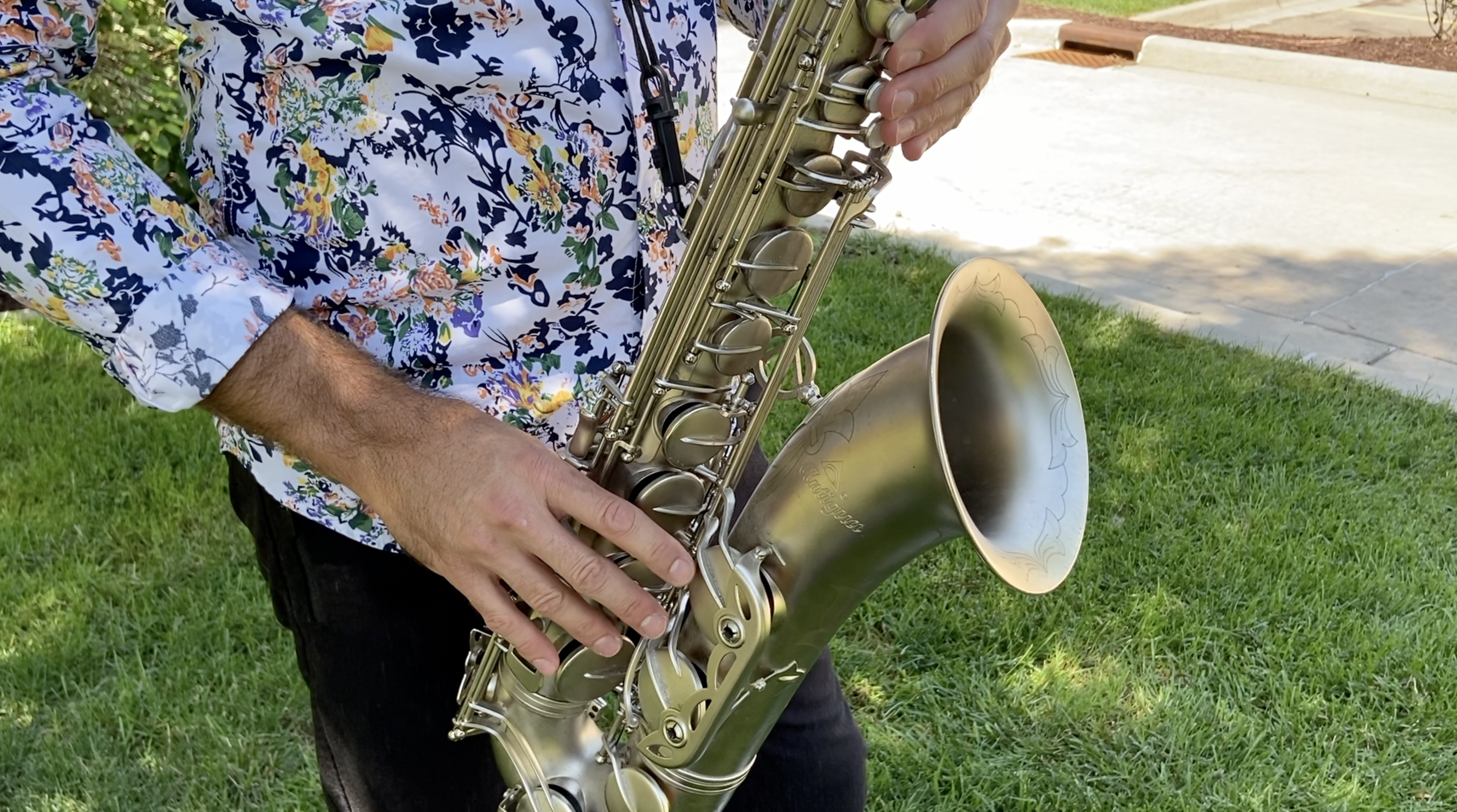 Close up of Phil Denny playing the saxophone