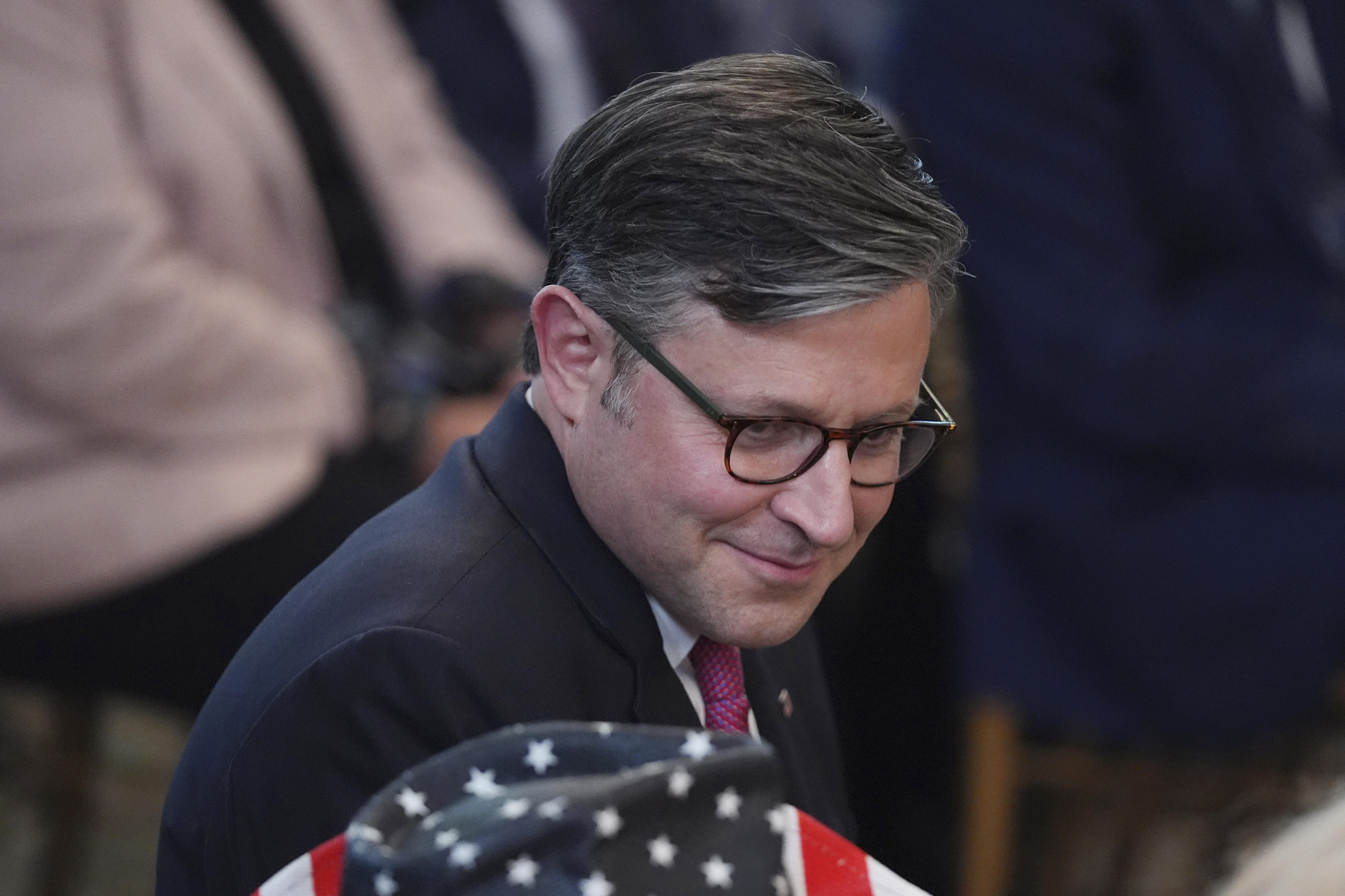Speaker of the House Mike Johnson, R-La., takes his seat before the arrival of President Donald Trump at a ceremony 