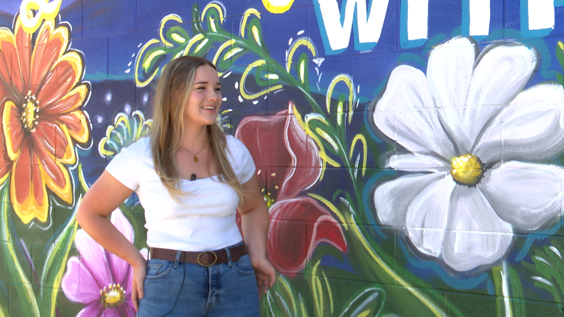 Julianne speaking about her mural